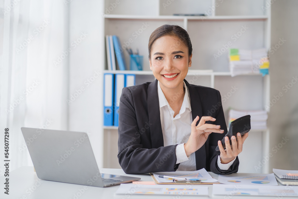 Financial inspector calculating a numbers in office room. Financial inspector calculating a numbers in office room.