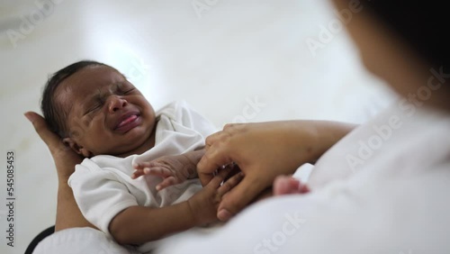 Close up mother hands holding newborn african black baby, copy space background banner family concept, Family love newborn healthcare medical concept.