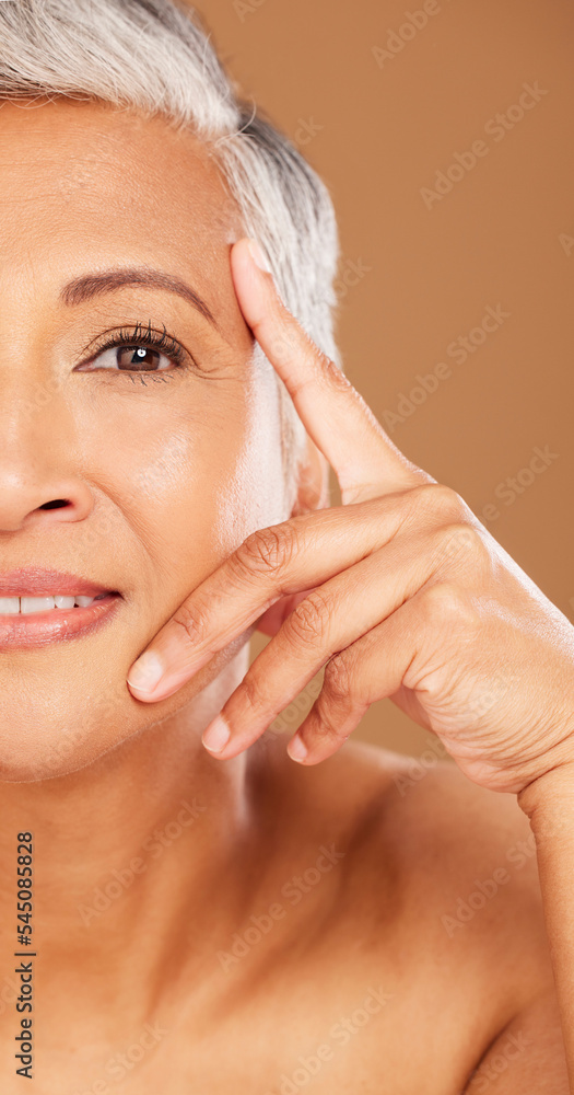 Old woman, beauty and half face portrait in studio isolated on a brown background. Luxury makeup, cosmetics and retired elderly female model thinking about facial skincare, health and skin wellness. Old woman, beauty and half face portrait in studio isolated on a brown background. Luxury makeup, cosmetics and retired elderly female model thinking about facial skincare, health and skin wellness.