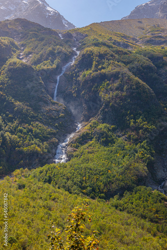 Tana glacier in North Ossetia, mountain waterfalls in the highlands.