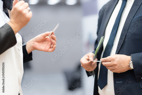 Business people exchanging business card on business meeting, Business discussion talking deal concept.