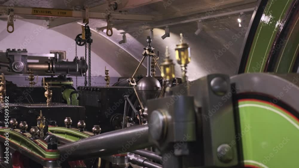 Steam Engine Of Iconic Tower Bridge In London Moving Slow Inside The Engine Room. static Steam Engine Of Iconic Tower Bridge In London Moving Slow Inside The Engine Room. static