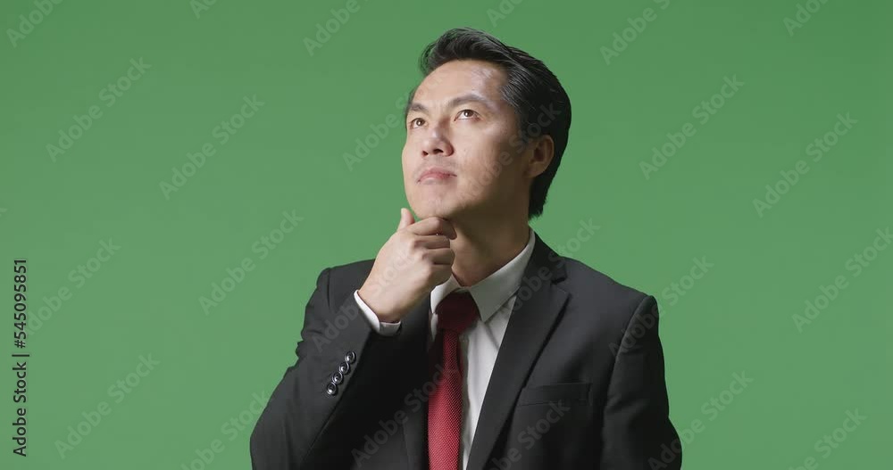 An Asian Business Man Thinking About Something And Looking Around On Green Screen In The Studio
An Asian Business Man Thinking About Something And Looking Around On Green Screen In The Studio