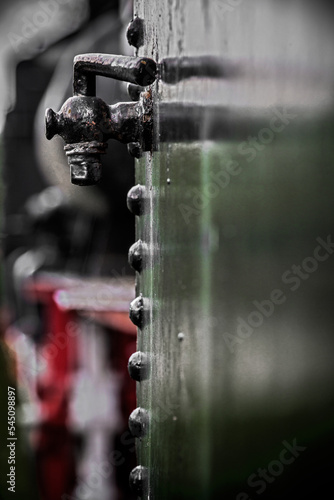 Details of old metal train cars and locomotives.