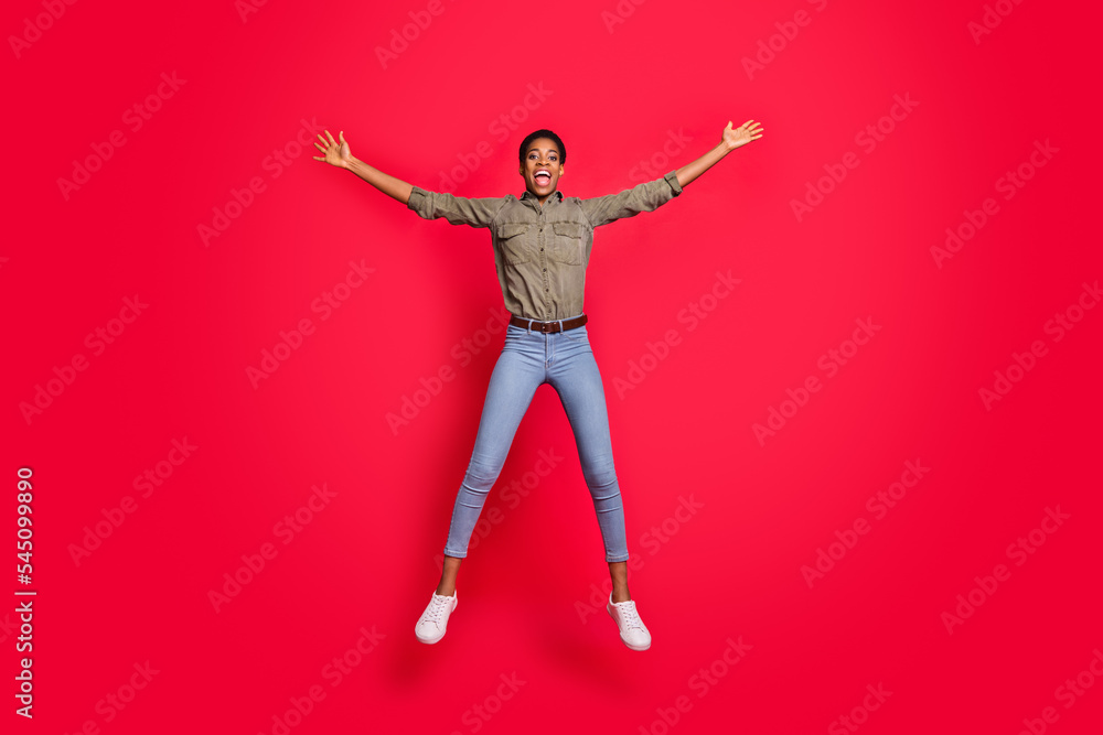 Full length photo of butch short hair female man jump wear smart casual shirt jeans isolated shine color background Full length photo of butch short hair female man jump wear smart casual shirt jeans isolated shine color background