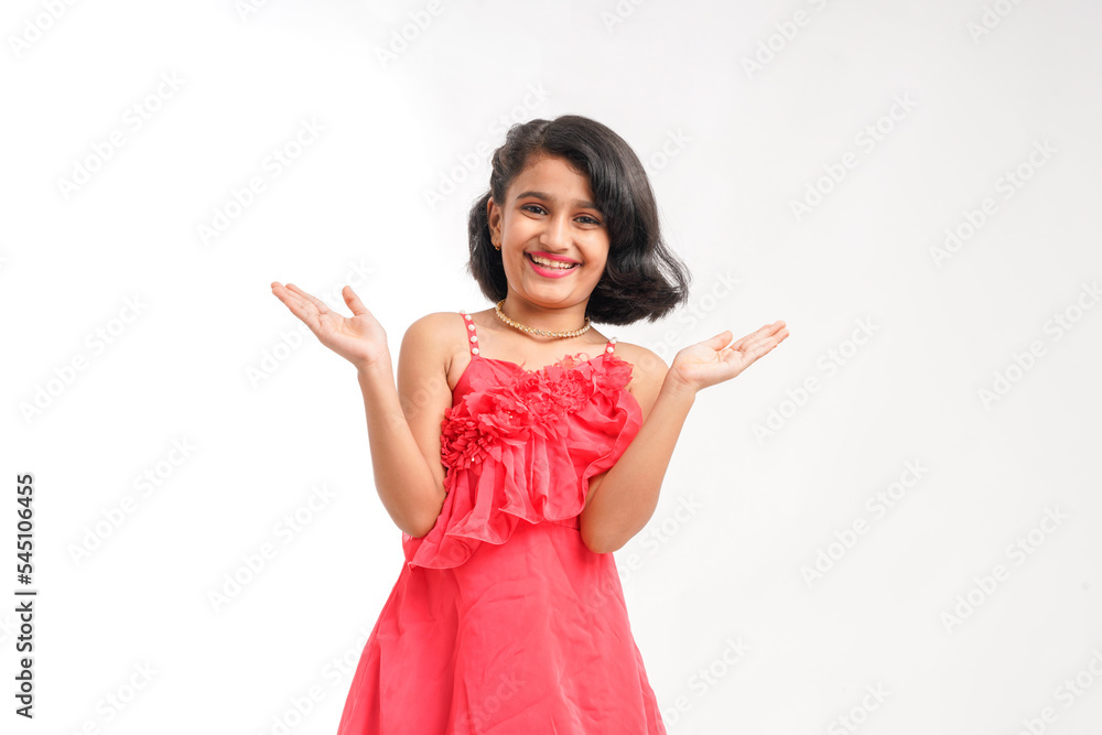 Cute indian little girl giving expression on white background Cute indian little girl giving expression on white background