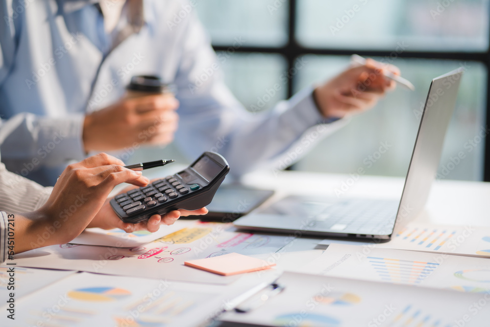 Group of business people meeting together Pointing to the graph assess business profits. Group of business people meeting together Pointing to the graph assess business profits.