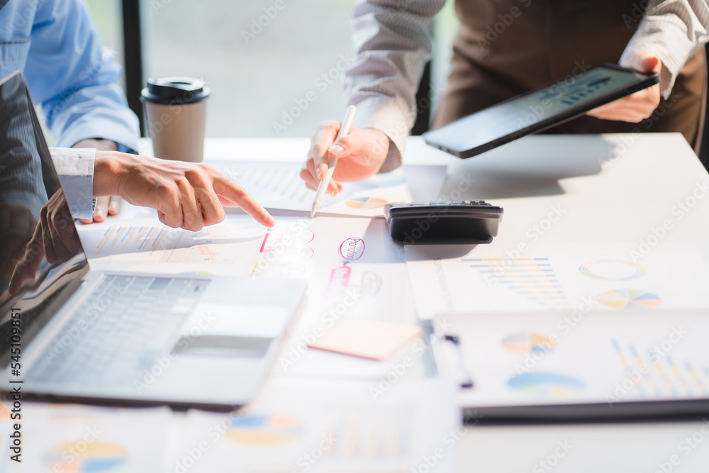 Group of business people meeting together Pointing to the graph assess business profits. Group of business people meeting together Pointing to the graph assess business profits.