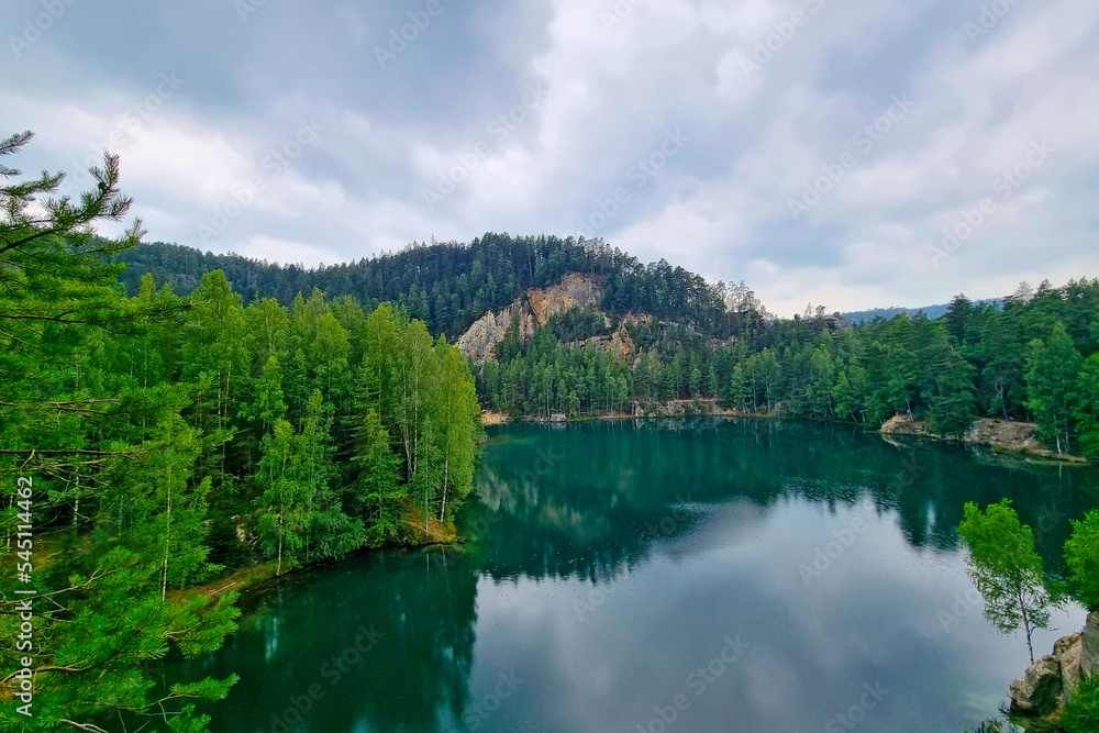 Picturesque mountain lake with turquoise water in the forest.