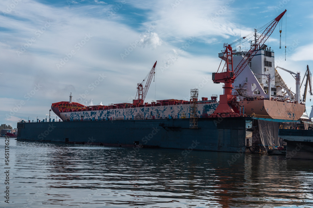 Ship in a dry dock in a repair shipyard in Gdansk