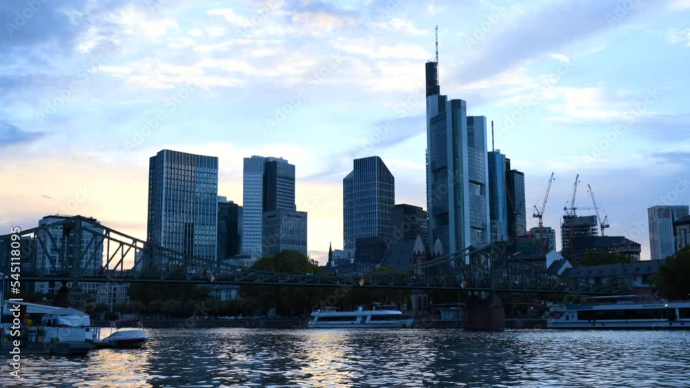 Bridge over Main River and business centre buildings in Frankfurt, Germany Bridge over Main River and business centre buildings in Frankfurt, Germany