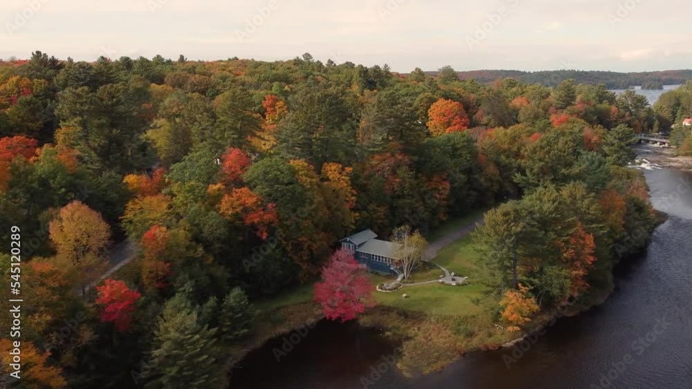 Villas On The Rivershore With Dense Autumn Trees Near Algonquin Provincial Park, Muskoka Region, Ontario Canada. Aerial Shot Villas On The Rivershore With Dense Autumn Trees Near Algonquin Provincial Park, Muskoka Region, Ontario Canada. Aerial Shot