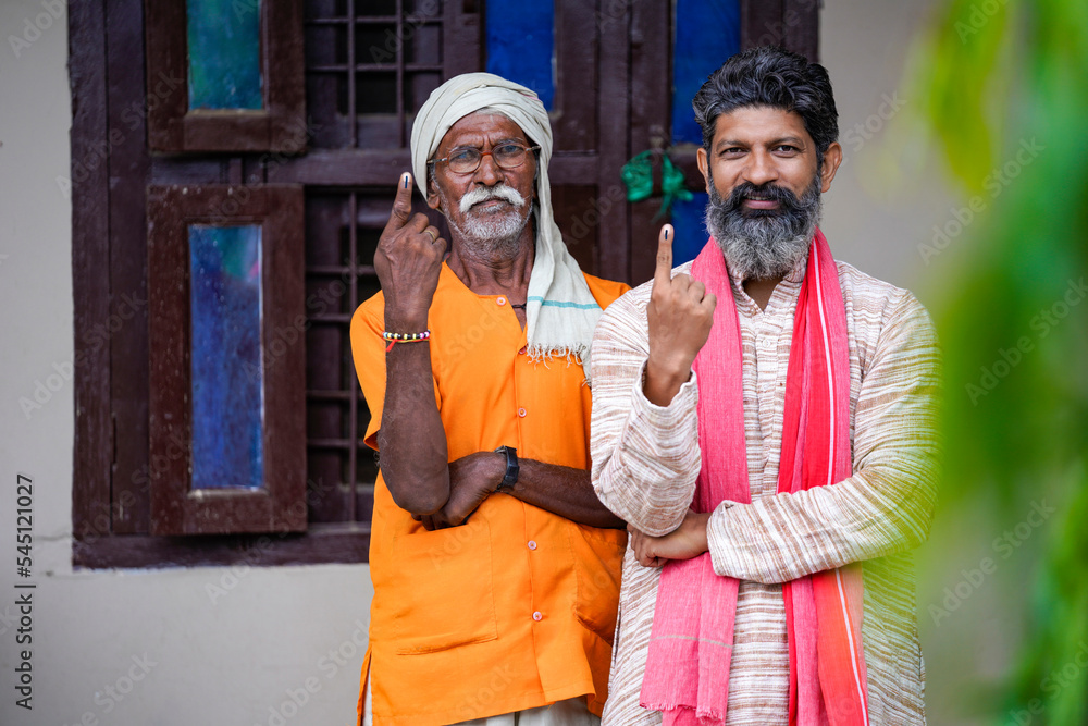 indian man showing finger after voting. voting sign in india