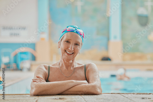 Senior woman, swimmer in water and relax in swimming pool of hotel resort for healthy elderly exercise, swim training and fun with friends. Happy elder, smile on face and retirement workout activity © C Haas/peopleimages.com