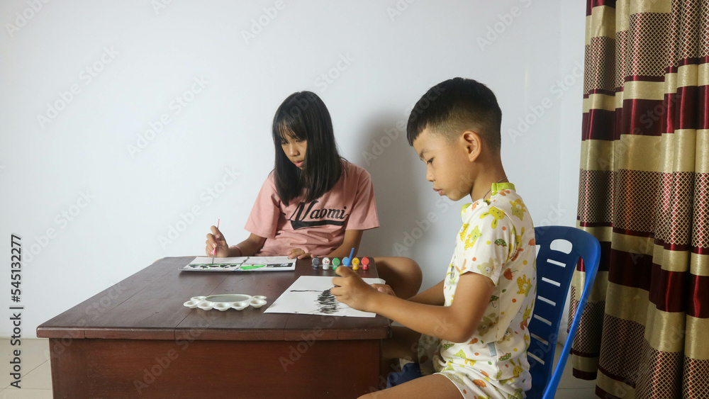 Brothers and Sisters are painting with watercolors Brothers and Sisters are painting with watercolors