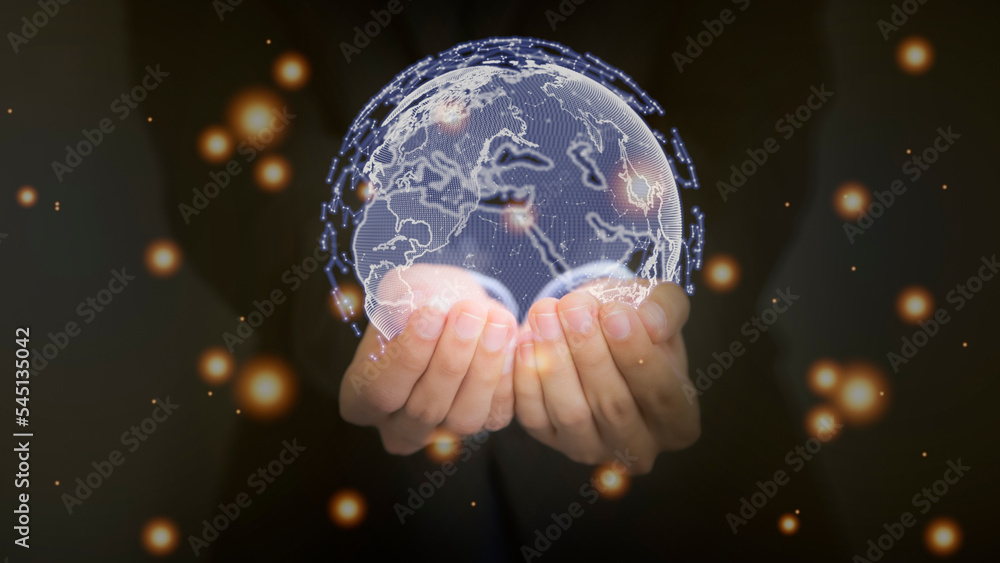 Fototapeta premium Businessman holding holographic image of the Earth. Science and technology concept.