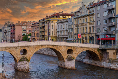 Sarajevo, Bosnia - May 2, 2022 - Library building was the City Hall before The War, and the Latin Bridge. photo