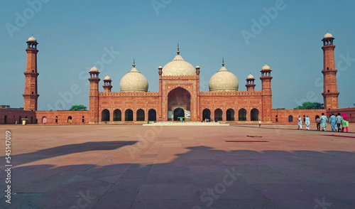 Badshahi Mosque, - June, 25, 2018: Lahore, Pakistan. Also Emperors Mosque, was built in 1673 by the Mughal Emperor Aurangzeb. It is one of the city best known landmark, and a major tourist attraction. photo