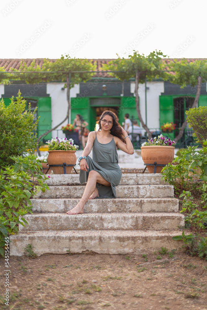 Fototapeta premium Happy young woman on a farm in the countryside