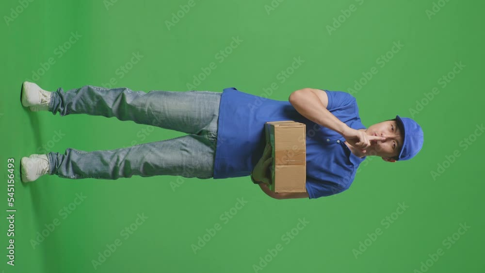 Full Body Of Asian Male Courier In Blue Uniform Smiling Crossing His Arms On Green Screen Background In The Studio
Full Body Of Asian Male Courier In Blue Uniform Smiling Crossing His Arms On Green Screen Background In The Studio