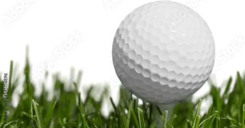 Golf ball on tee on green grass