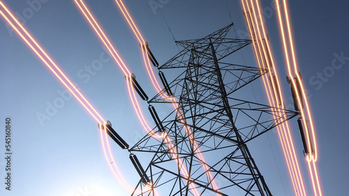 Electricity transmission towers with glowing wires