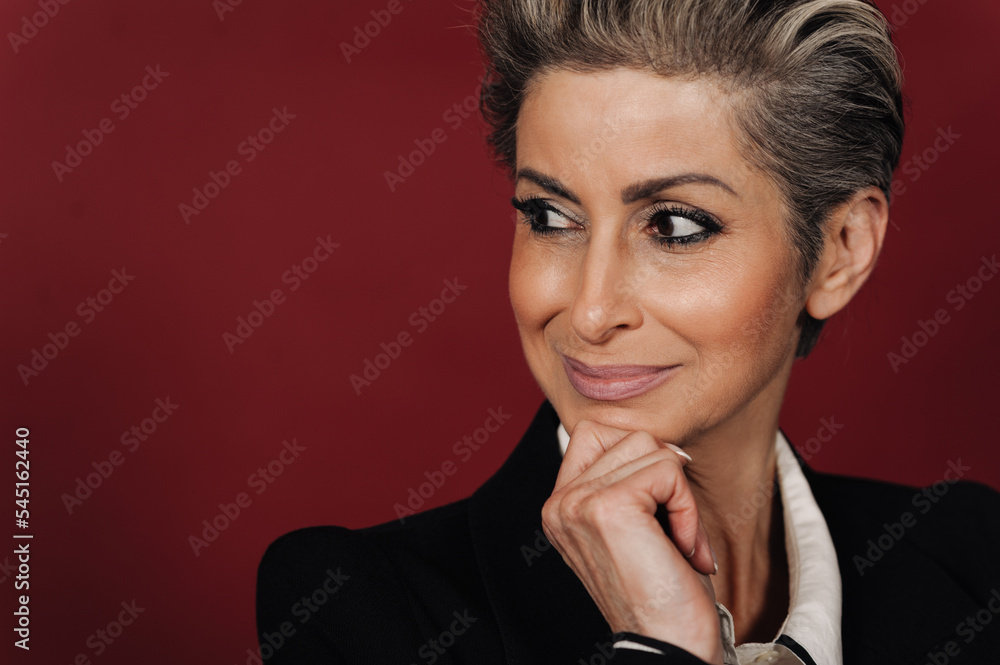 Beautiful senior woman with makeup looking aside and smiling Beautiful senior woman with makeup looking aside and smiling