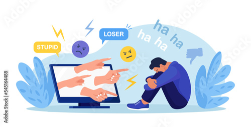 Cyber Bullying. Sad teenage man sitting in front of computer with dislike in social media, mockery. Depressed young person after insult, swear, verbal abuse in internet. Depression, stress concept