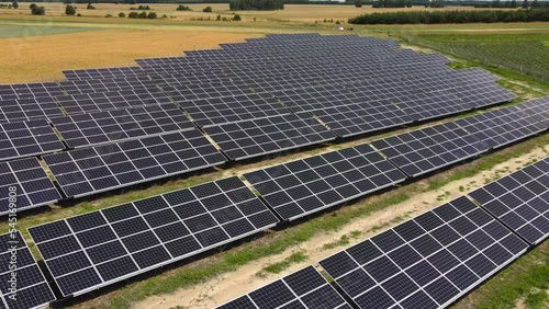 Aerial view, massive Solar panel farm on the field, alternative energy