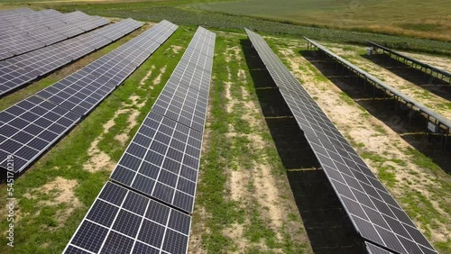 Aerial view, massive Solar panel farm on the field, alternative energy