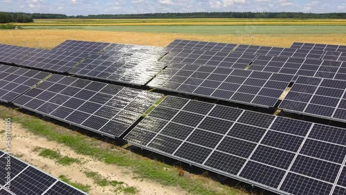 Aerial view, massive Solar panel farm on the field, alternative energy