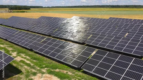 Aerial view, massive Solar panel farm on the field, alternative energy