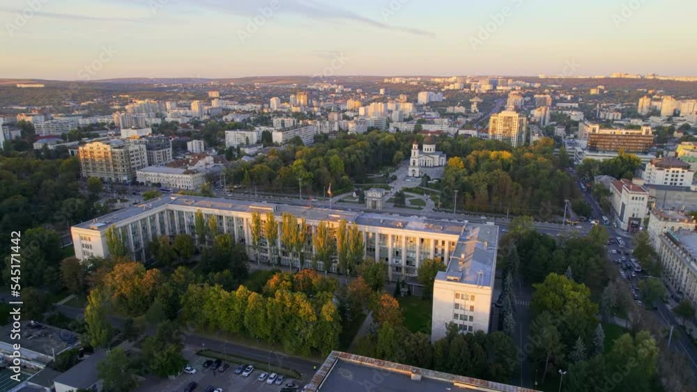 Aerial drone view of Chisinau downtown at sunset, Moldova. View of Central Park, Cathedral, Goverment and a lot of greenery, buildings Aerial drone view of Chisinau downtown at sunset, Moldova. View of Central Park, Cathedral, Goverment and a lot of greenery, buildings