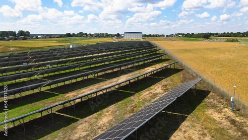 Aerial view, massive Solar panel farm on the field, alternative energy
