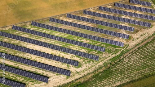 Aerial view, massive Solar panel farm on the field, alternative energy