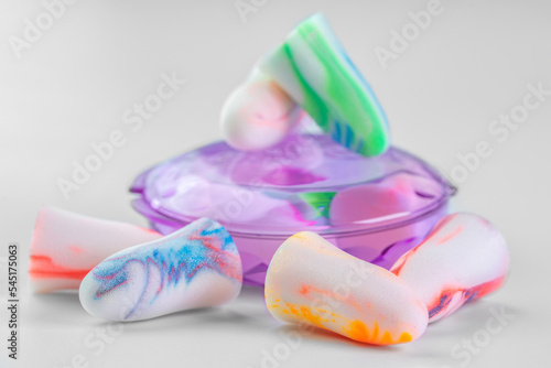 Earplugs and case on white background