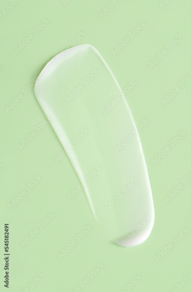 cosmetic smears cream texture on pastel green background cosmetic smears cream texture on pastel green background