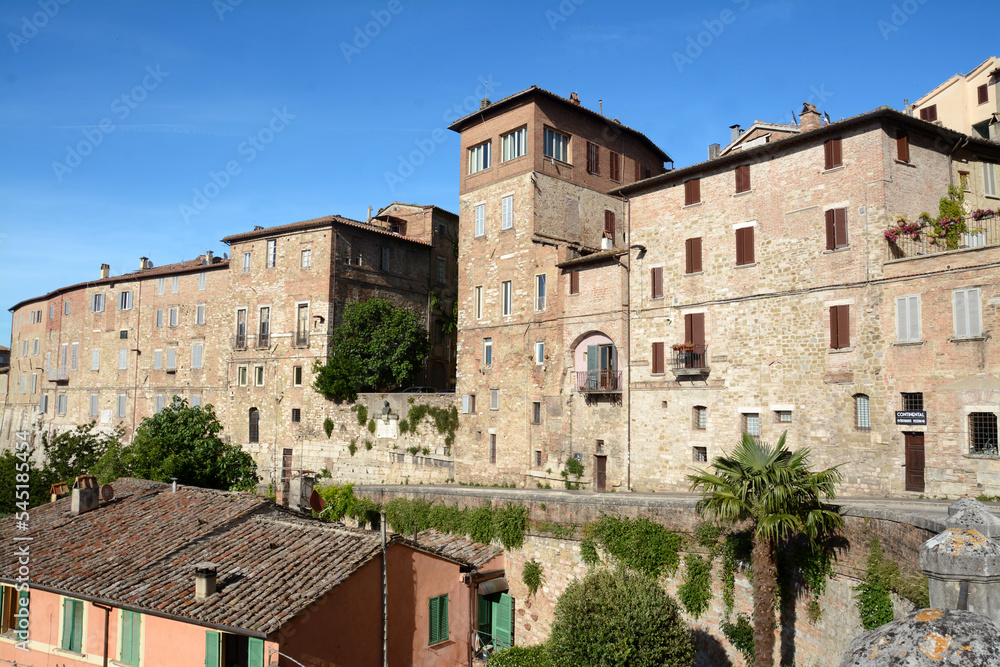 Ancient medieval stone houses in the historic center of Perugia in via Cesare Battisti above the medieval aqueduct of the Fontana Maggiore.