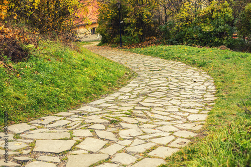 Fényképezés Stone pathway in autumn season.High quality photo.