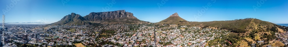 panoramic aerial view of Cape Town City with Devil's Peak, Table Mountain, Lion's Head and Signal Hill in the background - aerial panorama landscape 