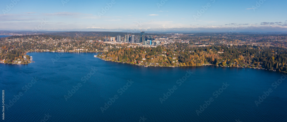 aerial panoramic landscape view across Lake Washington and Meydenbauer Bay to Bellevue Downtown with its skyscrapers during autumn season - Bird eye view 