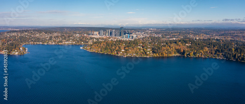aerial panoramic landscape view across Lake Washington and Meydenbauer Bay to Bellevue Downtown with its skyscrapers during autumn season - Bird eye view  photo