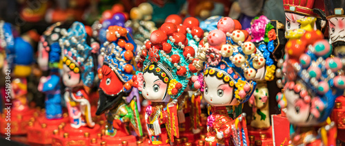 A row of traditional Chinese handicrafts Peking Opera mask dolls