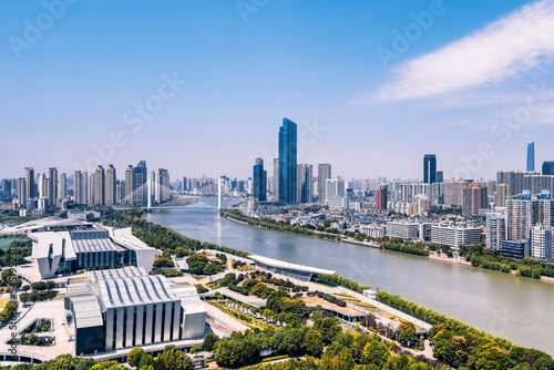 Sunny day scenery of Qintai Grand Theater and Han River in Wuhan, Hubei, China photo