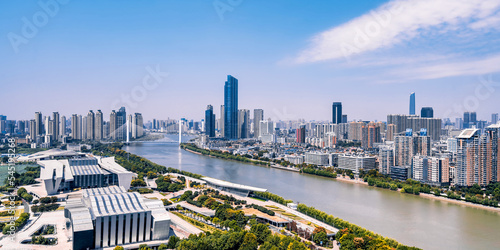 Sunny day scenery of Qintai Grand Theater and Han River in Wuhan, Hubei, China photo