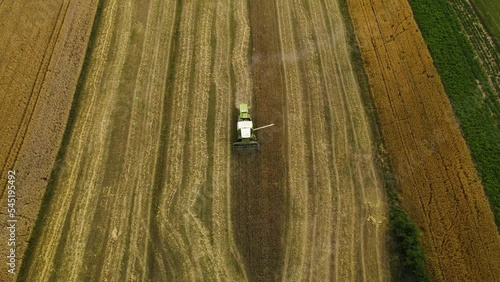 Aerial view agriculture machinery, traktor ride on day time working field tractor plow
