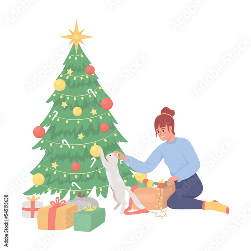 Girl keeping cat away from messing with Christmas tree semi flat color vector characters. Editable full body person on white. Simple cartoon style illustration for web graphic design and animation