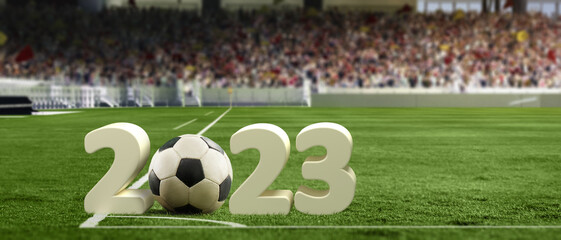 Traditional soccer football ball on grass of football field between huge numbers 2023 at crowded stadium with spotlight. Concept of sport, art, energy, power