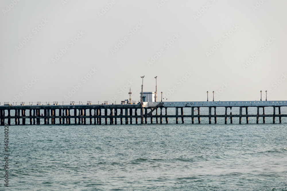 The iconic pier above the sea in the old port in the town of Puducherry.