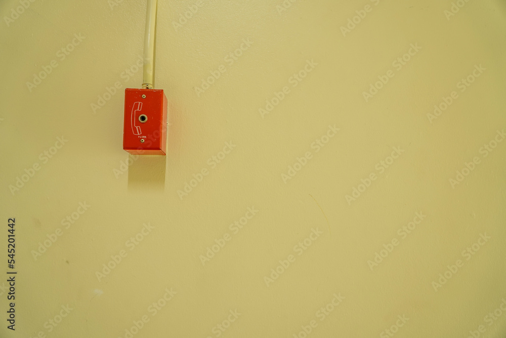 Fire Alarm And Fire Fighter Telephone Jacks On Yellow Brick Wall POTS fire-alarm-and-fire-fighter-telephone-jacks-on-yellow-brick-wall-pots